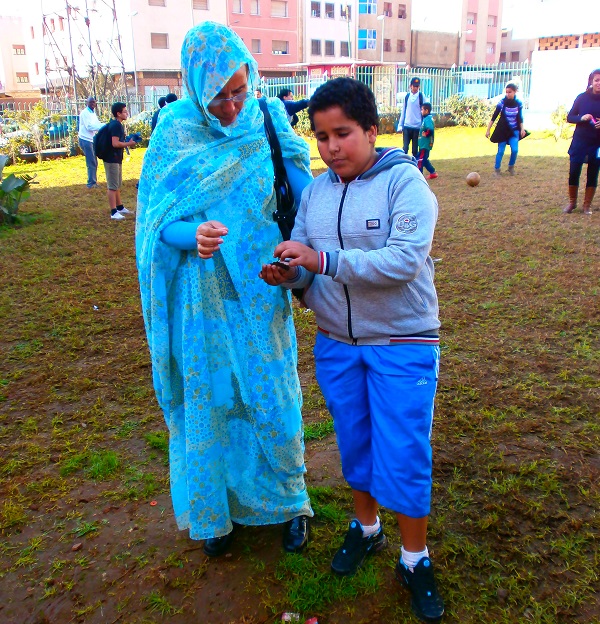 Aminetou with boy during human rights event