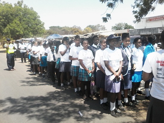 School children come together to advocate for girls' education. 